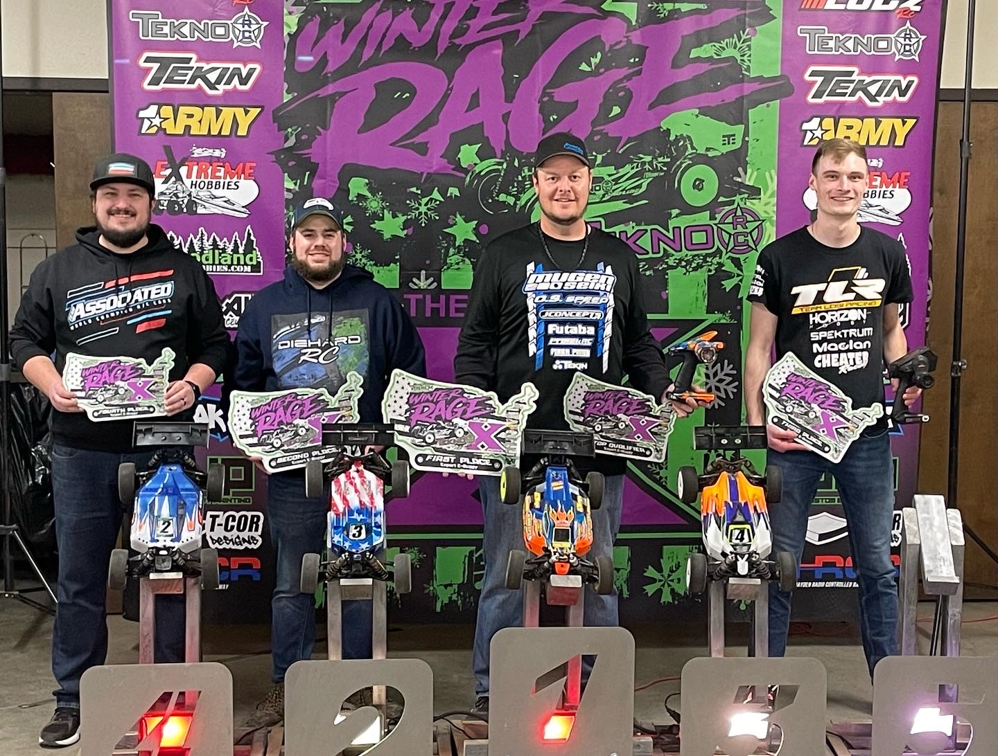 Protek RC’s Adam Drake And CJ Jelin Stand On Top Of The Box