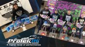 Protek RC’s Adam Drake And CJ Jelin Stand On Top Of The Box